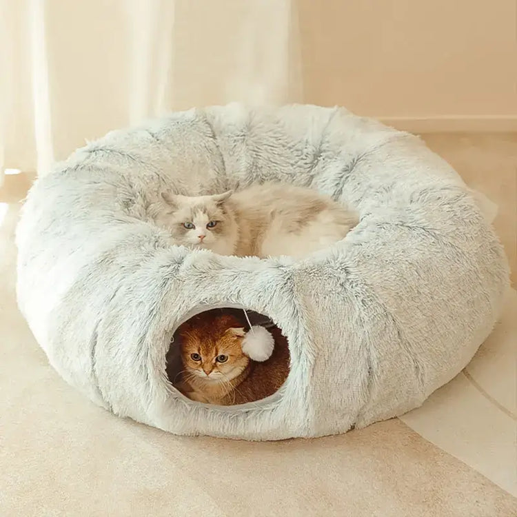 Two cats relaxing in a plush TAILTRAIL 2-in-1 round tunnel cat bed, showcasing cozy design and playful features.