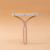 TAILTRAIL eco-friendly pet hair remover brush for effective hair and dander cleaning.