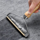 Eco-friendly pet hair remover brush by TAILTRAIL effectively collects pet hair from fabrics.
