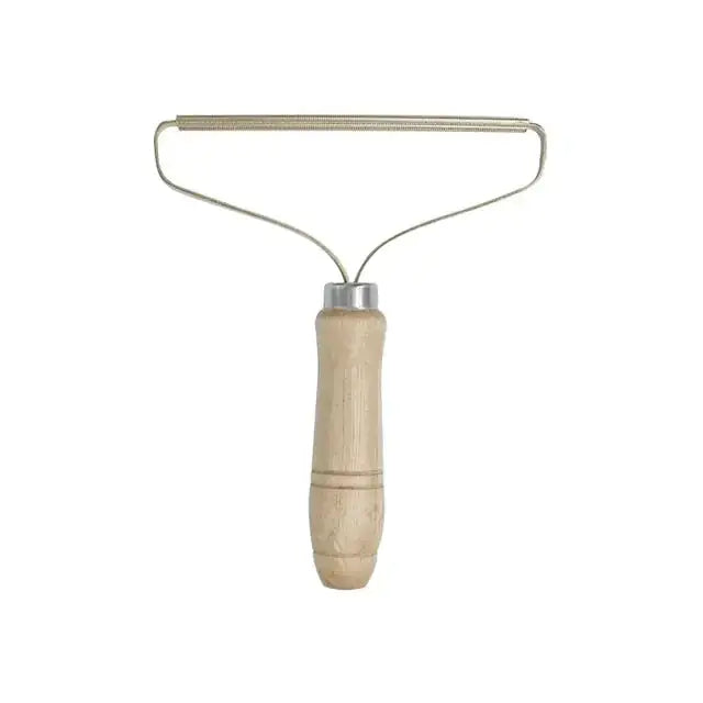 TAILTRAIL pet hair remover brush with wooden handle for easy hair removal from furniture and clothing.