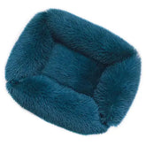 Plush Pet Bed in teal color designed for comfort, TAILTRAIL brand, ultra-soft with a non-slip bottom.