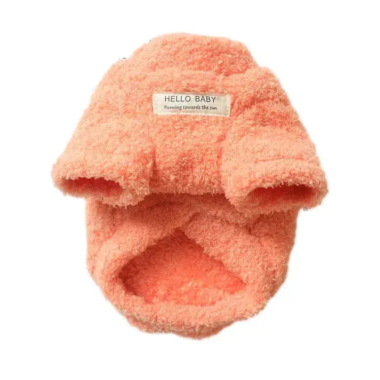 Plush winter coat for dogs in soft coral color by TAILTRAIL, perfect for keeping pets warm during winter.