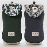 Premium dog coats by TAILTRAIL in green and navy, featuring stylish hoods for winter warmth.