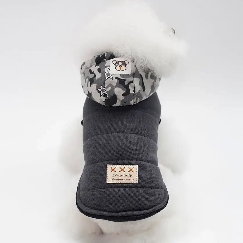 Premium dog coat for winter by TAILTRAIL, featuring a stylish hood and warm padding for chilly weather.