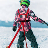 Child skiing with TAILTRAIL Safety Rope Ski Dog Training Belt for secure outdoor adventures.
