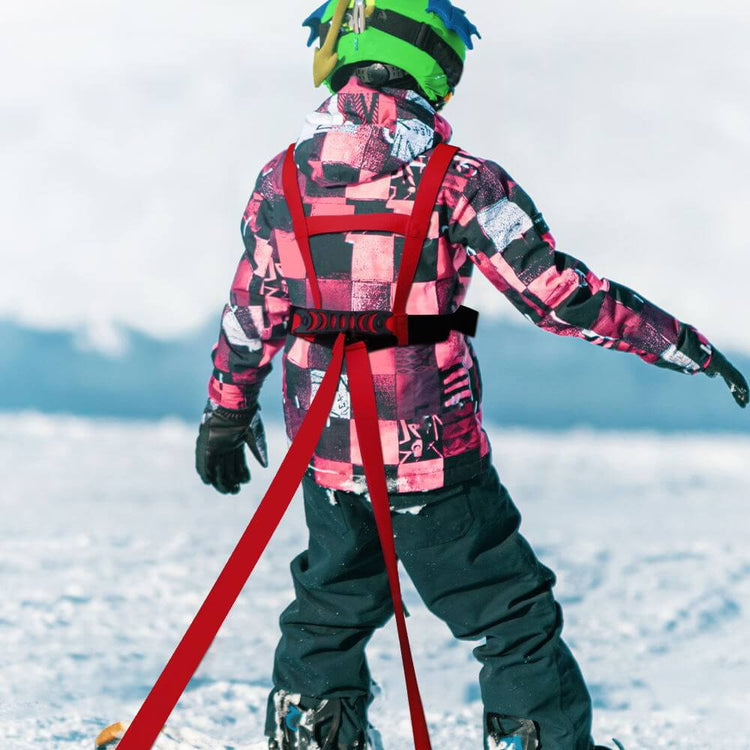 Child skiing with TAILTRAIL Safety Rope Ski Dog Training Belt for secure outdoor adventures.